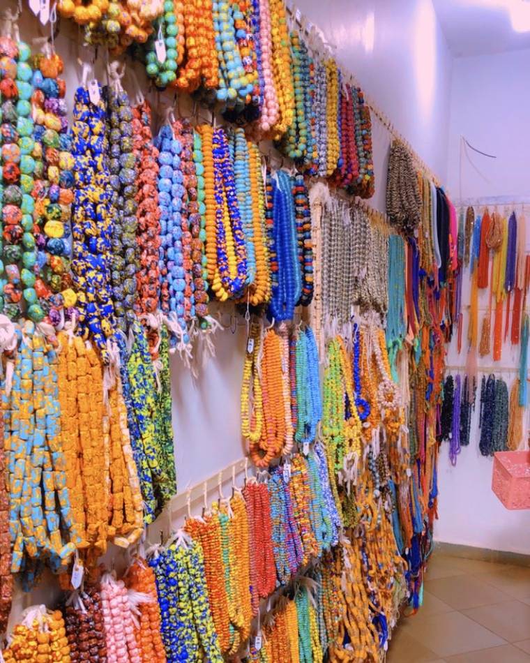 A wall of handmade Ghanaian glass beads for sale
